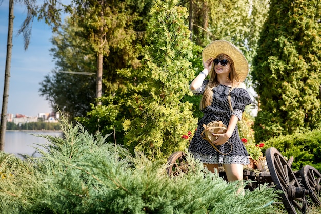 Woman wear blue dress in summer garden, lifestyle