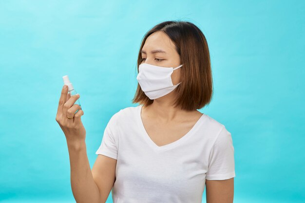 Woman wear protective masks and hand sanitizer