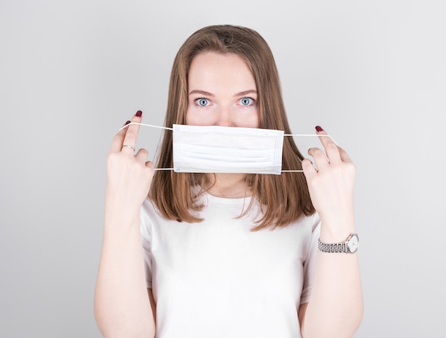 Woman wearing an anti virus protection mask to prevent others from corona COVID-19 and flu