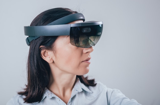 Woman wearing augmented reality goggles.