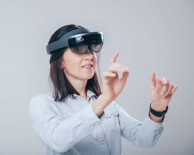 Woman wearing augmented reality goggles.