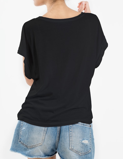 Woman wearing black t-shirt and short rip jeans on white