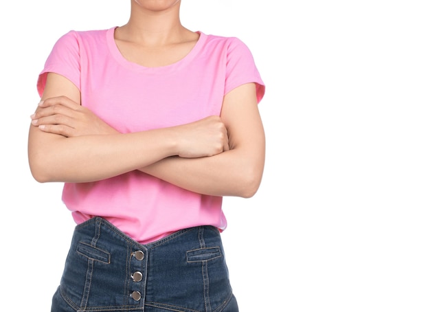 woman wearing blank pink t-shirt, jeans crossed arms isolated on white background