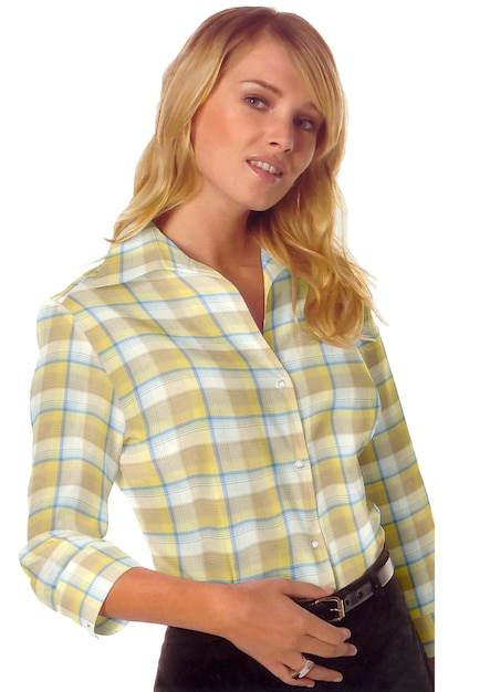 A woman wearing a check plaid shirt is posing for a photo