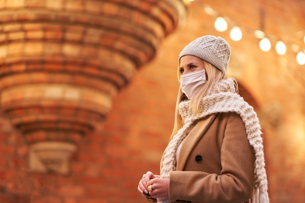 woman wearing face mask because of Air pollution or virus epidemic in the city