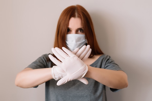 Woman wearing face mask and latex gloves. COVID-19 concept