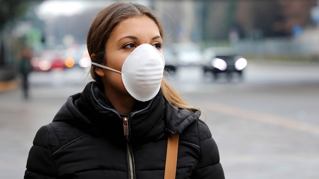 Woman wearing face mask protective spreading flu disease virus, protection against influenza viruses and diseases.