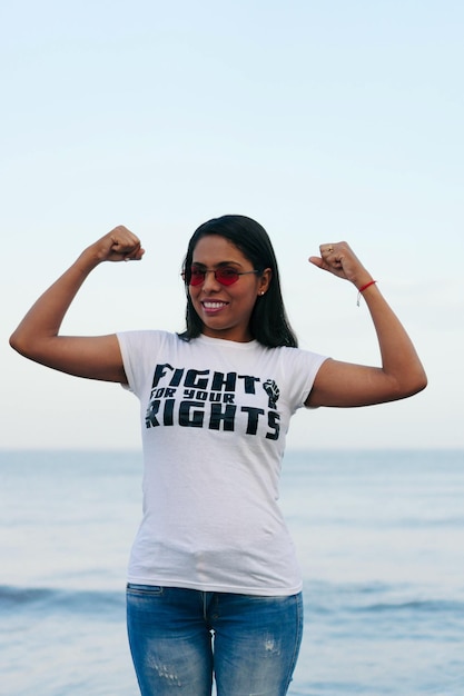 Woman wearing a feminist tshirt: 'Fight for your right'