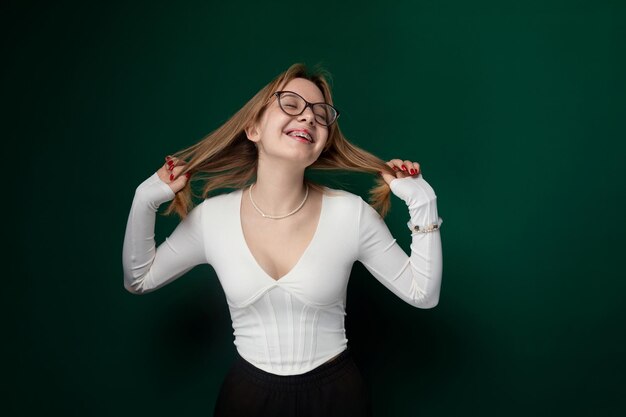 Woman wearing glasses and white shirt