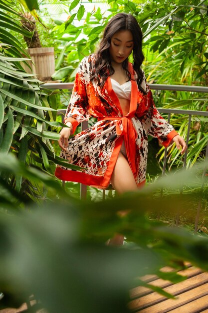 Woman wearing light summer dress on tropical resort