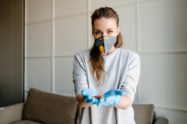 Woman wearing mask showing no gesture with hands crossed