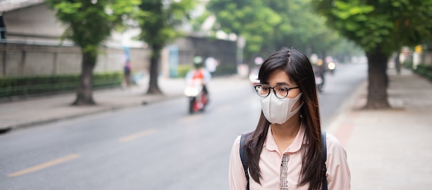 Woman wearing n95 respiratory mask protect and filter pm2.5