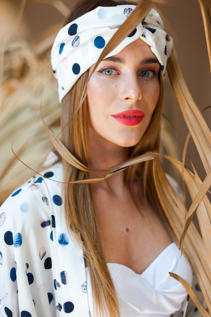 A woman wearing a polka dot headband with a polka dot headband