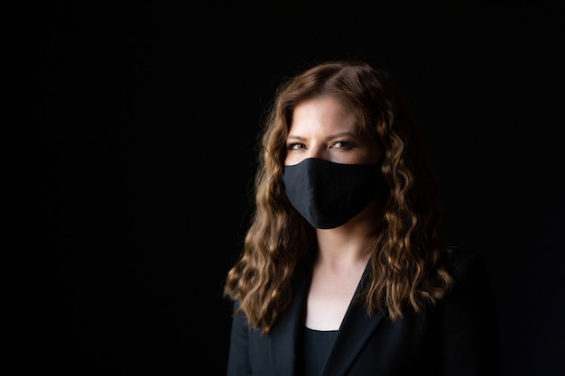 woman wearing a protective black face mask