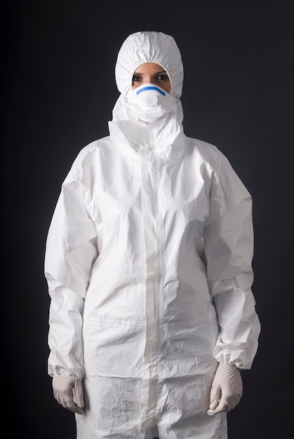 woman wearing protective dress for ebola covid or pandemic virus