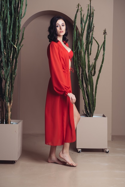 Woman wearing red beach tunic