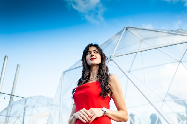 Woman wearing red dress outdoor summer portrait