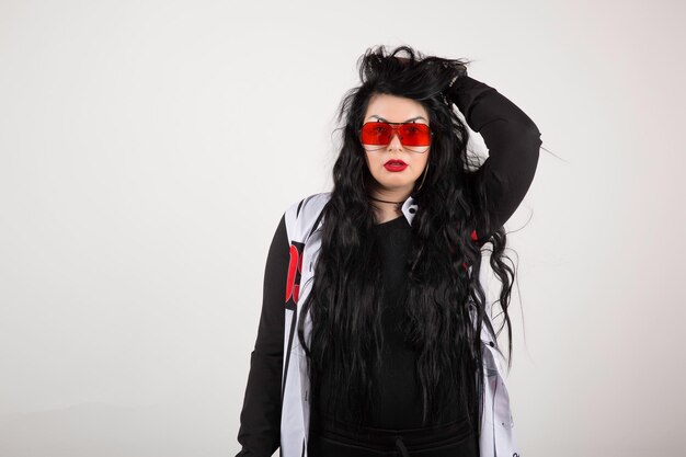 Photo woman wearing red glasses on white background