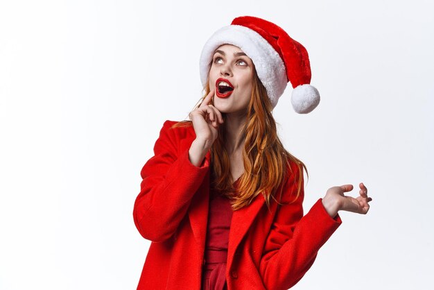 Woman wearing santa hat emotions fun posing studio fashion