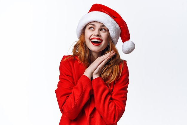 Woman wearing santa hat emotions fun posing studio fashion