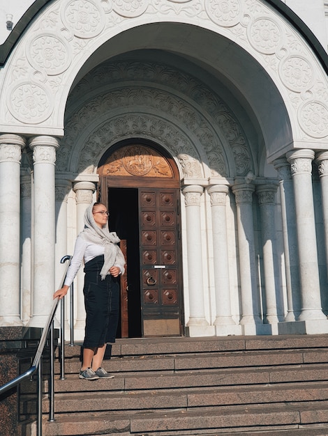 Woman wearing a scarf on a church