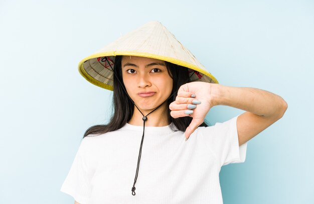 Woman wearing a vietnamese hat