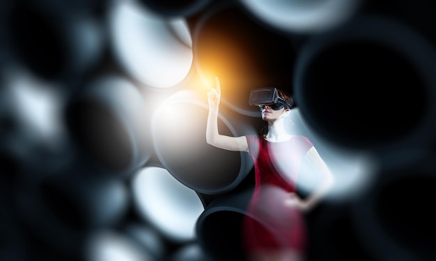 Woman wearing virtual reality goggles. Mixed media