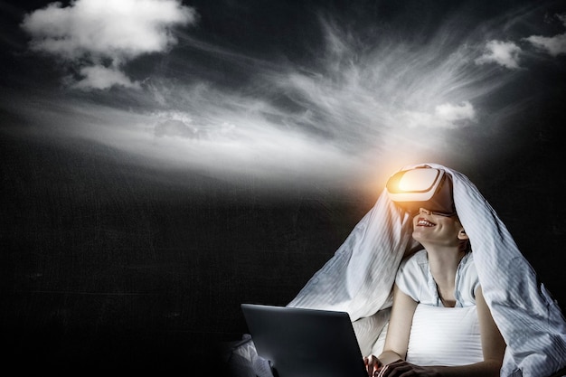 Woman wearing virtual reality goggles. Mixed media