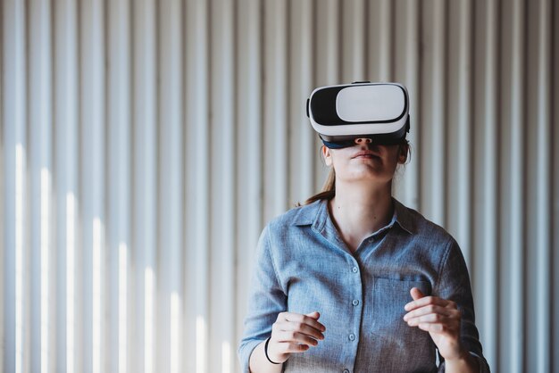 woman wearing virtual reality goggles