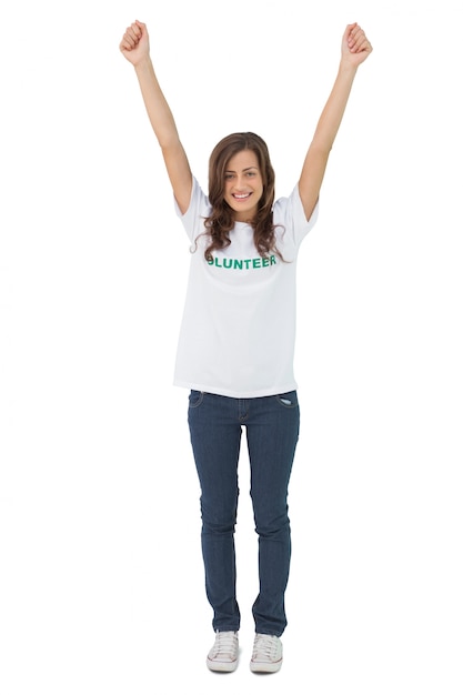 Woman wearing volunteer tshirt raising her arms