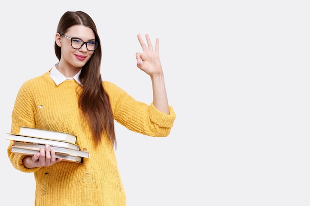 Woman wearing a yellow sweater