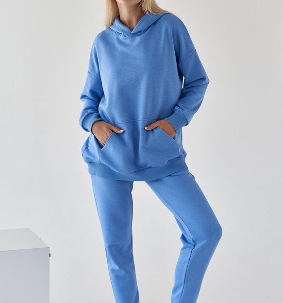 Woman wears azure blue textile sport outfit