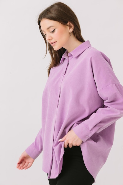 A woman wears a long sleeved shirt from the brand new collection.