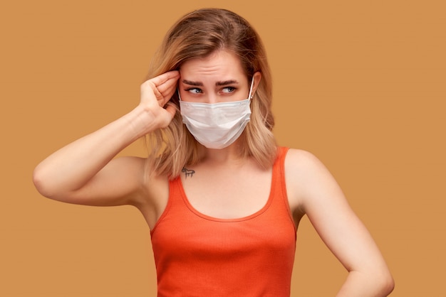 Woman wears protective white mask