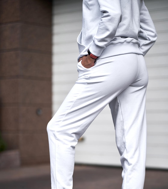 Woman wears white pants sport girl is wearing light trousers