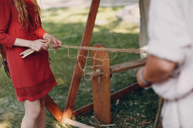 Woman weaves a fishing net