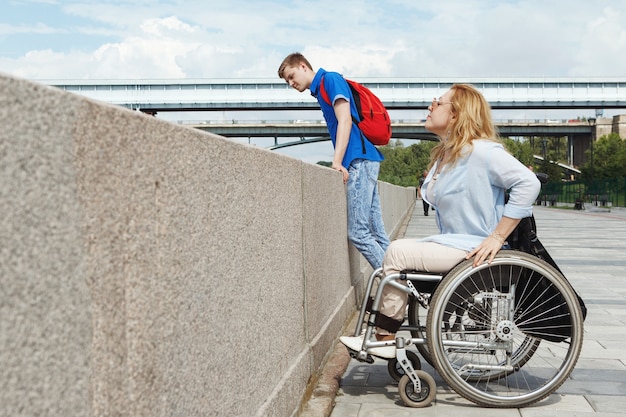 Woman in a wheelchair using a ramp