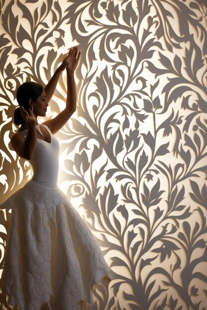 Photo a woman in a white dress is dancing in front of a white patterned wall