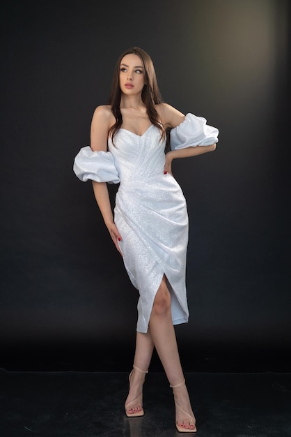 Woman in a white dress with ruffles on the bottom and a skirt that says'i love you '