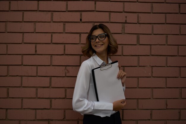 Woman in white shirt documents work professional High quality photo