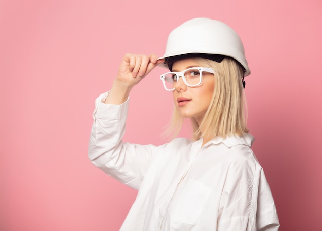 Woman in white shirt, glasses and helmet