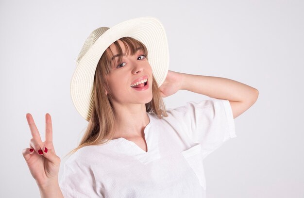 Woman in white shirt and hat