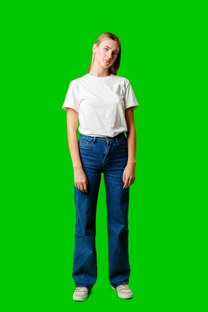 Woman in white shirt and jeans posing for picture