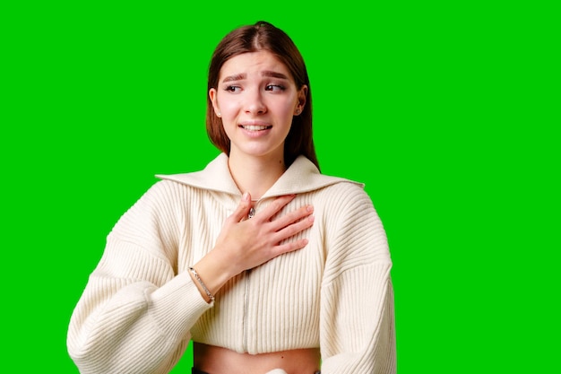 Woman in white sweater posing for picture