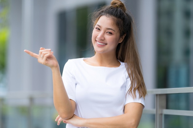 Woman in white t-shirt and blue jeans