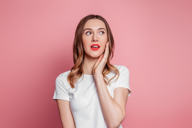 woman in white tee shirt with red lipstick