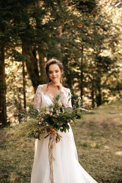 woman in a white wedding dress with a beautiful bouquet