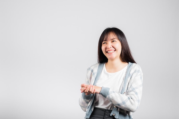 Woman winning and surprised excited screaming laughing studio shot isolated white background, Happy Asian portrait beautiful young female lifestyle cheerful smiling and laugh funny with copy space