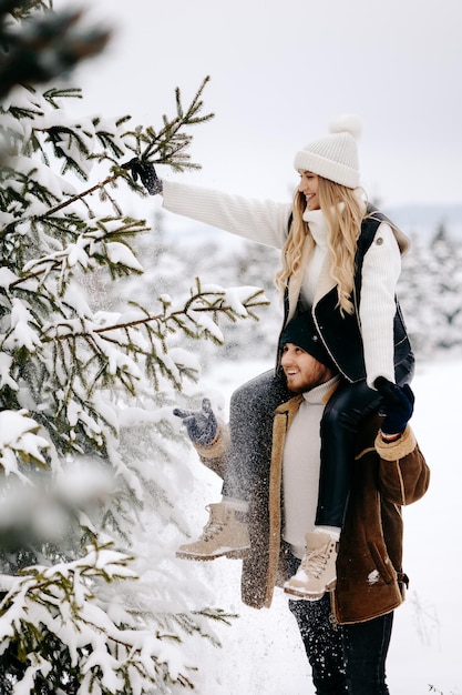 woman in winter forest a couple in the woods in winter