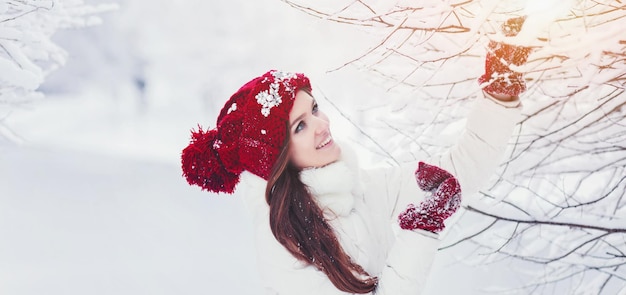 Woman in a winter snowy forest